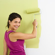 Happy woman painting.