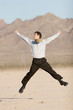 Happy businessman jumping in air Happy businessman jumping in air