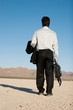 Businessman carrying his laptop Businessman carrying his laptop