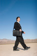Businessman carrying his laptop case Businessman carrying his laptop case