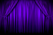 Large purple curtain with spot light and fading into dark. Large purple curtain with spot light and fading into dark.