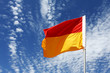 A red and yellow swimming safety flag on an Australian beach.