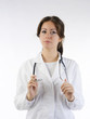 cute brunette in white medical gown   and a stethoscope