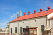 Photo: Corrugated iron building with red roof on mine premises Corrugated iron building with red roof on mine premises