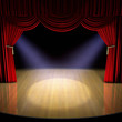 Theatre stage with red curtain