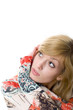 Young blonde in colored shirt staring up