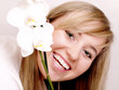 Close up of beautiful woman with white orchid
