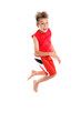 An enthusiastic, excited, happy boy jumps off the ground. An enthusiastic, excited, happy boy jumps off the ground.