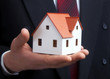 Hand of the businessman with the house