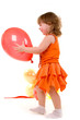happy girl playing with colorful balloons