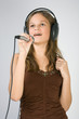 Young pretty girl singing.