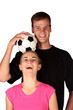 Two football fans having some interactive fun