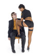 Nerdy businessman sitting on chair in front of stripteaser Nerdy businessman sitting on chair in front of stripteaser