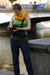 Glamour-styled girl with a camera in the citylife