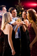 Five friends clinking  glasses with each other