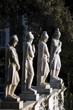 row of marble statues looking down on Piazza Del Popolo, Rome