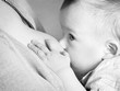 A toddler baby breastfeeding