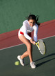 Teenage girl playing tennis
