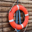 Life ring on wooden panels