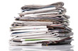 Stack of newspapers on white background Stack of newspapers on white background