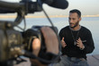 Team Of Cameraman & Host Filming On Location