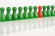 red piece between green pieces aon a white background