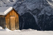 Snow covered mountain hut in alpine scenery Snow covered mountain hut in alpine scenery