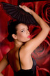 beautiful hispanic girl with black fan dancing flamenco dance