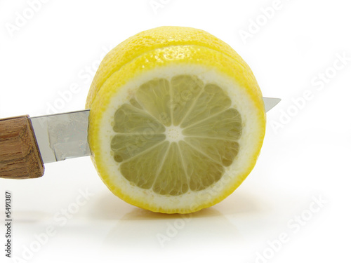 Fresh lemon knife on a white background. Fresh lemon knife on a white background.