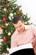 young man sitting with laptop for christmas