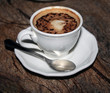 A cup of espresso coffee on a brown granite table A cup of espresso coffee on a brown granite table