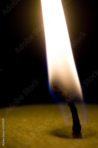 Photo: Candle's flame on a black Candle's flame on a black