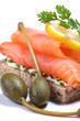 Smoked salmon sandwich with capers and lemon