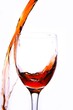 Perform to pouring red wine outside the wineglass.