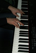 Hand of musician on piano 