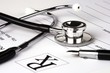 Photo: A Stethoscope over a medical report form. A Stethoscope over a medical report form.