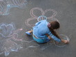 female child drawing picture with chalk female child drawing picture with chalk