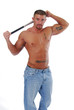 Foto: A shirtless muscular man with a bat behind his head A shirtless muscular man with a bat behind his head