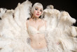 Beautiful Woman holding feathers in lingerie
