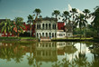 An old reflected in the water