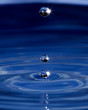 Three water spheres above a wave pattern