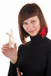 Photo: Young woman with new year tree as ear ring Young woman with new year tree as ear ring