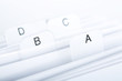 Close up of a business card holder. Focus on letter "A"
