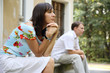 Foto: Woman and man sitting on marble steps, selective focus Woman and man sitting on marble steps, selective focus