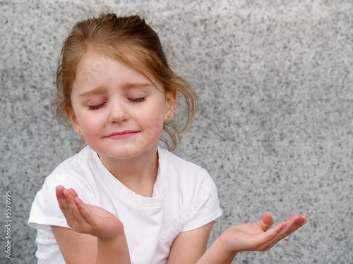 Photo: little girl with upturned hands as in prayer or meditation little girl with upturned hands as in prayer or meditation