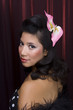 Latin hair model on red background.