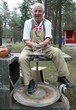 Photo: Old potter working with clay on wheel Old potter working with clay on wheel