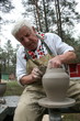 Photo: Old potter working with clay on wheel Old potter working with clay on wheel
