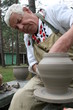 Photo: Old potter working with clay on wheel Old potter working with clay on wheel