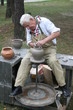 Photo: Old potter working with clay on wheel Old potter working with clay on wheel